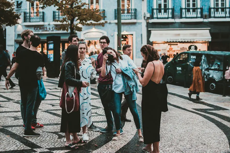 A picture of a young couple looking happy and in love, surrounded by a group of photographers taking their picture.