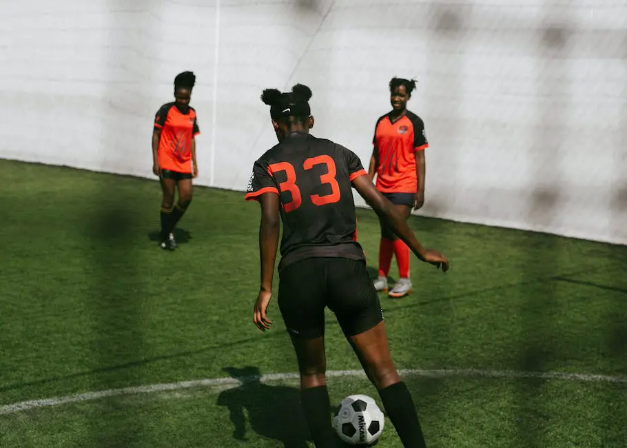 A group of female football players standing together, looking determined and ready to play